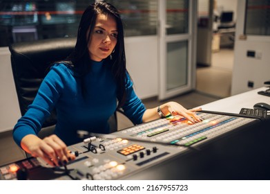 Beautiful Middle Aged Beautiful Woman Working On A Tv Station As A Producer In A Broadcast Control Room. Show Production Maker. Portrait Of A Beautiful Woman Producer Working.