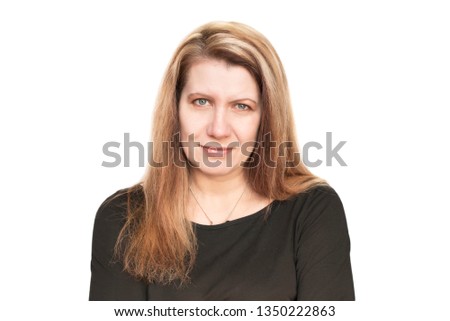 A beautiful middle-aged woman on a white background with long, painted hair. The woman is happy because recently she painted her hair so that it was not visible that it was gray