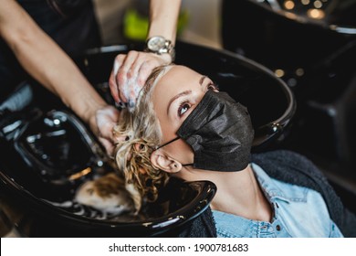 Beautiful Middle-aged Woman With Protective Face Mask In Hair Salon.