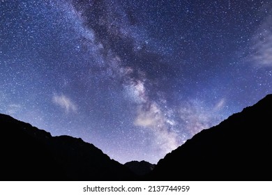 Beautiful milkyway galaxy over the silhouette mountains.