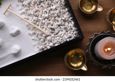 Beautiful Miniature Zen Garden, Candle And Oil Lamps On Wooden Table, Flat Lay