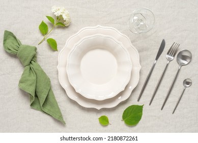 Beautiful Minimal Table Setting In Beige And Green. Top View. Textured Object, Selective Focus.