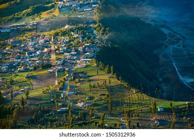 Beautiful misty morning view of Cemoro Lawang village in Bromo Tengger Semeru National Park in East Java Indonesia from Penanjakan view point. - Shutterstock ID 1505312936