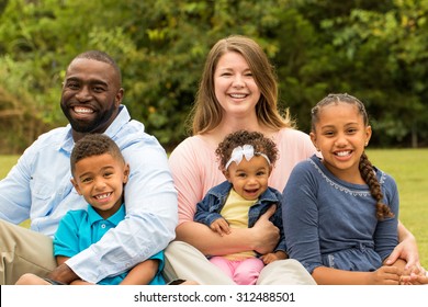 Beautiful mixed race family. Bi racial family. African American and Caucasian family. - Powered by Shutterstock