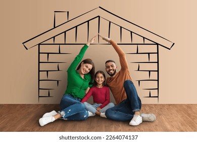 Beautiful mixed race family dreaming about their own house, happy mother and middle eastern father holding hands over their cute little daughter head, sitting on floor over house sketch, collage - Shutterstock ID 2264074137