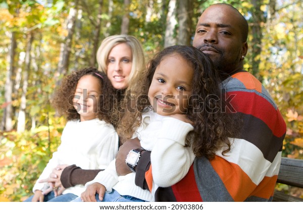 Beautiful Mixed Race Family Enjoying Park Stock Photo (Edit Now) 20903806