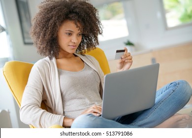 Beautiful mixed-race woman shopping on internet - Shutterstock ID 513791086