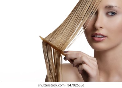 Beautiful Model Comb Wet Hair  After Washing On White