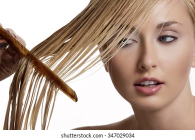 Beautiful Model Comb Wet Hair  After Washing On White