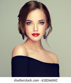 Beautiful Model Girl  With Elegant Hairstyle . Woman With Fashion Style Makeup