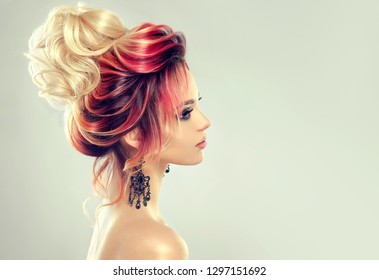 Beautiful Model Girl  With Elegant  Multi Colored Hairstyle . Stylish Woman With Fashion  Hair  Color Highlighting.   Creative  Red And Pink Roots ,   Trendy  Coloring. 