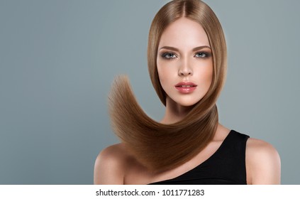 Beautiful Model Girl With Shiny Brown And Straight Long  Hair . Keratin  Straightening . Treatment, Care And Spa Procedures. Smooth Hairstyle