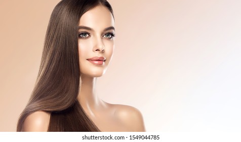 Beautiful Model Girl With Shiny Brown And Straight Long Hair. Keratin  Straightening. Treatment, Care And Spa Procedures. Smooth Hairstyle