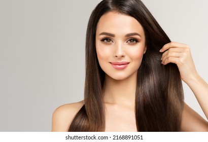 Beautiful model girl with shiny brown and straight long  hair . Keratin  straightening . Treatment, care and spa procedures. Smooth hairstyle
 - Powered by Shutterstock