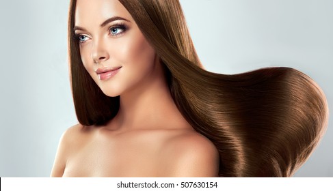 Beautiful Model Girl With Shiny Brown Straight Long  Hair . Care And Hair Products .