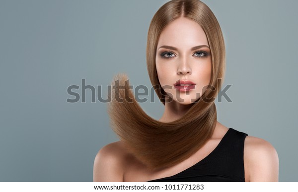 beautiful model girl shiny brown straight stock photo