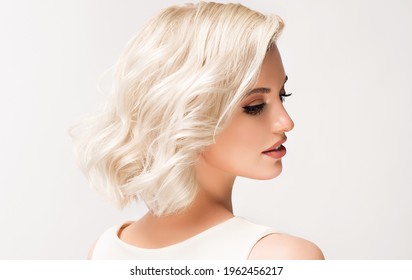 Beautiful Model Girl With Short Hair .Beauty  Smiling Woman With Blonde Curly Hairstyle Dye .Fashion, Cosmetics And Makeup