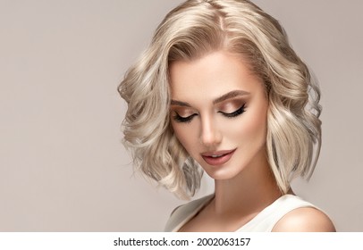 Beautiful Model Girl With Short Hair .Beauty Woman With Blonde Curly Hairstyle Dye .Fashion, Cosmetics And Makeup