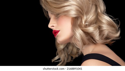 Beautiful model girl with short hair .Beauty woman with blonde curly hairstyle dye . Red lips and manicure nails .Fashion, cosmetics and makeup