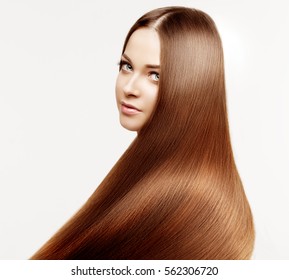 Beautiful model with healthy shiny long hair. Beauty luxurious hairstyle by stylist in salon hair care