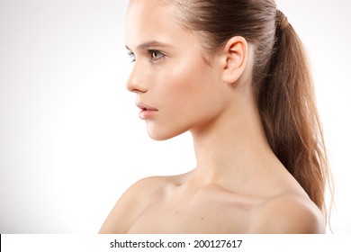 Beautiful Model Lady With Natural Make-up And Brunette Hair Studio Fashion Shot On White Background, Perfect Skin