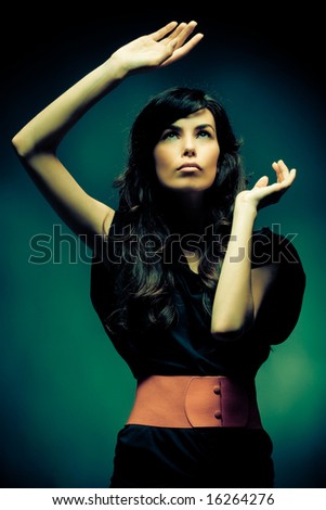 Beautiful model portrait with dramatic light crossprocessed