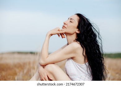 Beautiful Model Wearing Summer Cotton Dress Posing In Autumn Field With Hay Stack. Boho Style Clothing.