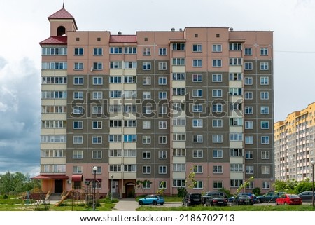 Beautiful modern multi-storey building in a new area of the city. View of the windows of an apartment panel house. An ordinary apartment building in a Russian city.