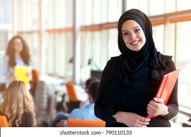 beautiful modern Muslim businesswoman portrait in office - Powered by Shutterstock