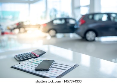 Beautiful modern showrooms with cars that sell background as new cars in stock blur for the four-wheeled tire industry, set at a large warehouse.