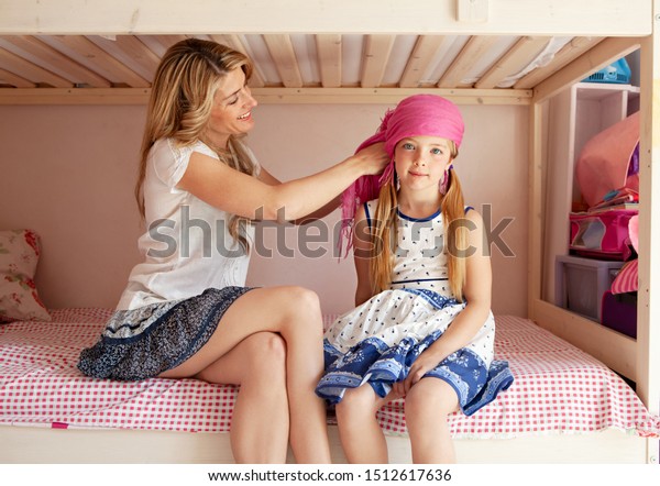 Beautiful Mom Helping Child Daughter Dressing Stock Photo