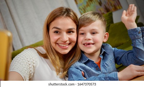 Beautiful Mom And Son Making Selfie At Home. Happy Family Having A Facetime Video Call. Unity, Connection, Technology Concept