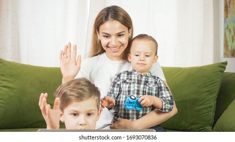 Beautiful Mom With Sons Having A Facetime Video Call. Happy Family Taking Selfies And Video Chatting At Home. Mother's Day, Unity, Connection Concept. 