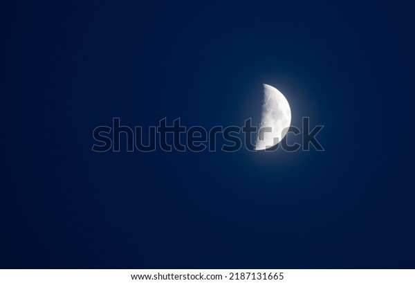 Beautiful moon in\
blue sky midsummer quarter\
moon