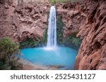 Beautiful Mooney Falls and surrounding rock wall in Havasupai