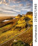 Beautiful morning golden light shining on popular Isle of Skye landscape seen from the Quiraing. Scotland, UK.