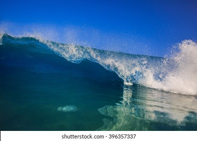 Beautiful Morning Shorebreak Surfing Wave. Rip Curl In Bright Blue Ocean. Clear Blue Sky Seascape With Nobody On Image.