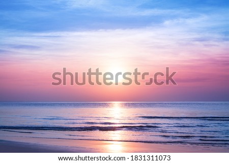 Beautiful morning sunrise, blue sea, pink sky, white clouds, yellow sun glow, golden reflection on water, peaceful landscape, quiet sunset on ocean beach, dawn seascape, Thailand, Koh Samui island