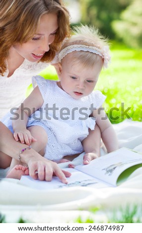 Similar – Reading stories Parenting