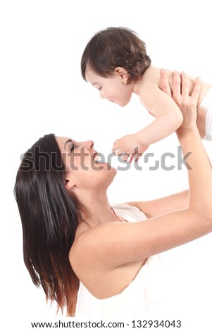 Beautiful mother raising her daughter isolated on a white background