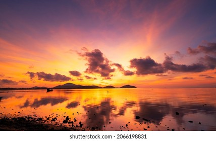 Beautiful motion blur long exposure sunset or sunrise with dramatic sky clouds over calm sea in tropical phuket island Amazing nature view and light of nature seascape