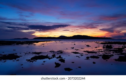 Beautiful motion blur long exposure sunset or sunrise with dramatic sky clouds over calm sea in tropical phuket island Amazing nature view and light of nature seascape