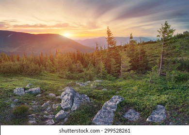 Beautiful mountain landscape with dramatic sky on sunset in Carpathian mountains
