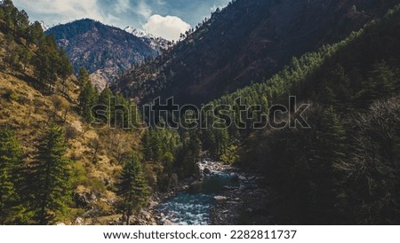 beautiful mountain landscape with a river surrounded by forest - Parvati Valley, Himachal Pradesh - India
