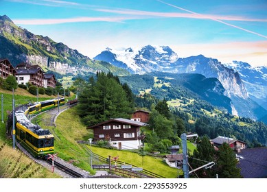Beautiful mountain landscape with train in canyon of the city Lauterbrunnen in the Swiss Alps, Switzerland. Amazing places.
