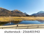 Beautiful mountain panorama at Upper Engadin Valley with Inn River in the Swiss Alps on a sunny autumn day. Photo taken November 15th, 2024, Samedan, Switzerland.