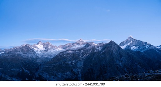 Beautiful mountain range with blue sky on Swiss Alps in the dawn at Zermatt, Switzerland - Powered by Shutterstock