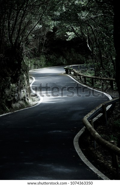 Beautiful mountain road in Tenerife. Road\
travel concept. Car travel\
adventure