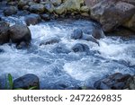 beautiful mountain water flow passing through river stream