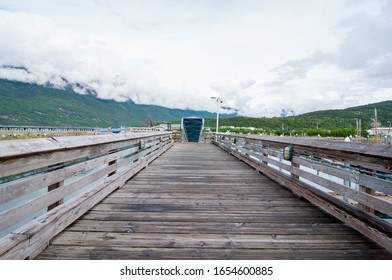 Beautiful Mountains Covered With Snow In Skagway Alaska Near The Fishing Dock With A Wooden Old Bridge